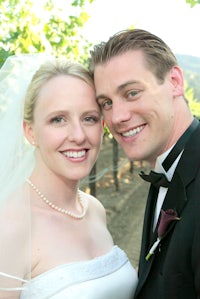 a bride and groom posing for a picture
