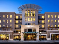 the exterior of a hotel at dusk